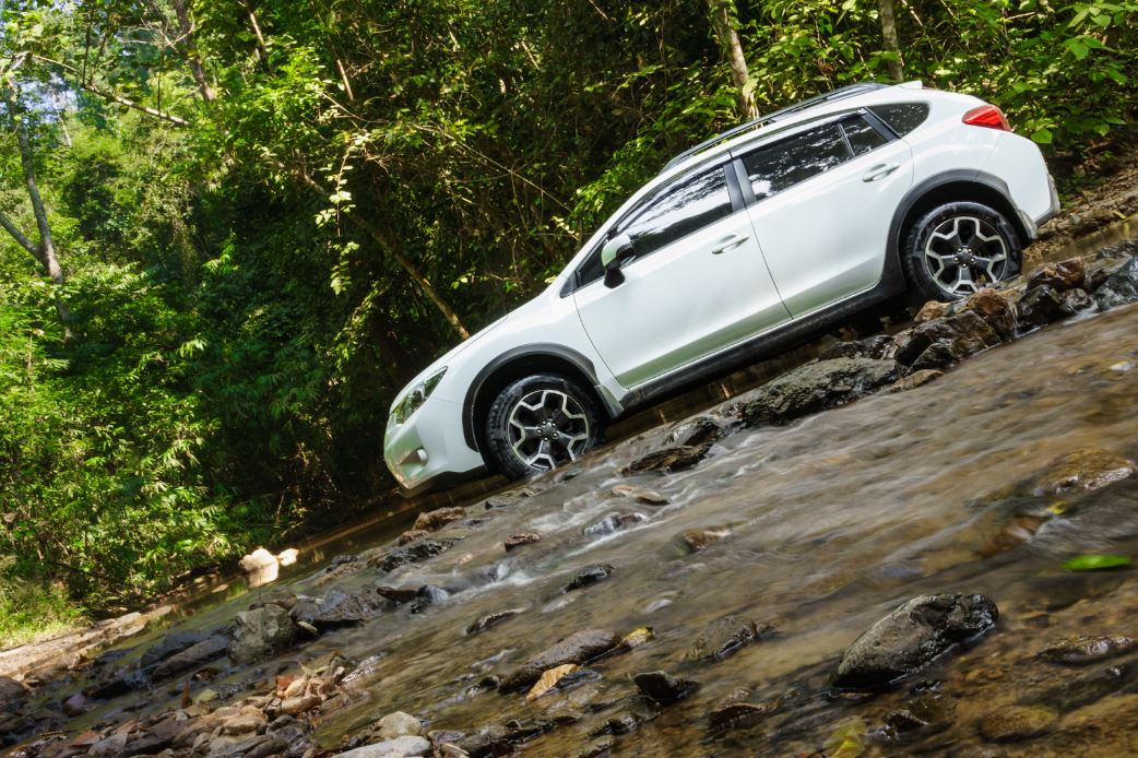 Are subarus generally a low-maintenance vehicle in Colorado Spring, CO with Express Auto Repair on Galley. Image of white subaru outback hatchback vehicle parked along rolling stream in wooded area. Subaru vehicles are known for their reliability, safety, and ruggedness, making them a top choice for drivers who need a car capable of handling diverse conditions. For potential buyers or current Subaru owners in Colorado Springs, CO, understanding the maintenance needs of your Subaru is essential to ensuring its longevity and performance. At Express Auto Repair, we’re here to help you navigate the specifics of Subaru maintenance, service costs, and how these vehicles compare to other Japanese cars in terms of upkeep.