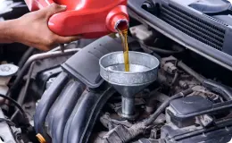 a mechanic performing an oil change