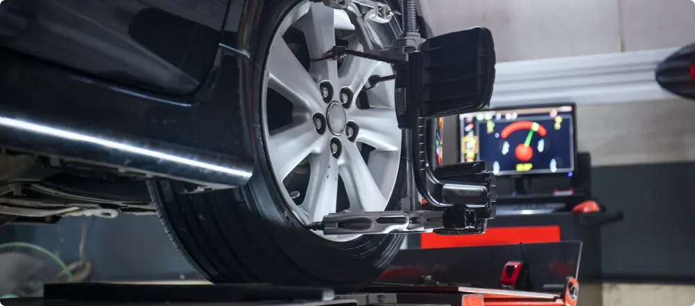 Wheel Alignment , Auto Repair in Colorado Springs, CO at Express Auto Repair. wheel alignment equipment on a tire