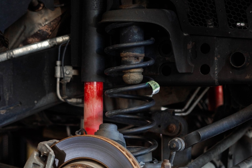 Car Suspension Repair in Colorado Springs CO At Express Auto Repair. Close-up view of a vehicle suspension system