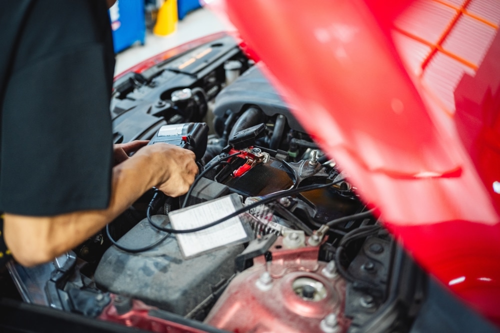 Winter Vehicle Diagnostics in Colorado Springs CO At Express Auto Repair. Mechanic performing a vehicle diagnostic