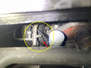 A/C charge-port area marked during a Chevrolet Traverse inspection at the Briargate shop